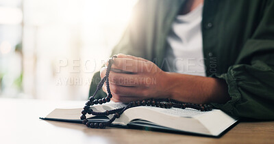 Buy stock photo Bible, hands and person reading book with beads in spiritual religion for peace, guidance and learning. Rosary, house or worship with praise, scripture and gratitude with prayer, faith and gospel