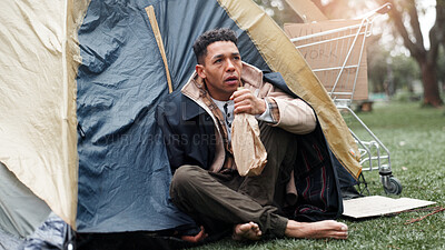 Buy stock photo Man, poverty and outdoor with alcohol, homeless and tent with addiction, thinking and perspective on ground. Person, bottle and sad with reflection for grief, bankrupt and poor with stress in Brazil