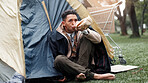 Man, poverty and outdoor with alcohol, drink and tent with addiction, thinking and perspective on ground. Homeless person, bottle and reflection with grief, bankrupt and poor with stress in Brazil