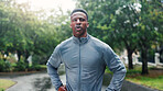 Fitness, man and tired with resting at park for running fatigue, workout recovery and cardio challenge. Runner, black person and breathing in road with marathon break, exhausted or dedication in rain