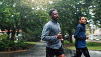 Fitness, rain and men running in road for marathon training, endurance and discipline with cardio exercise. Friends, teamwork and runner club with workout, sports challenge and morning jog in nature