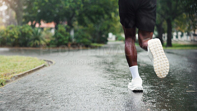 Buy stock photo Legs, running and man with training, outdoor and practice with wellness, exercise and athlete. Closeup, person and runner in park, morning routine or hobby with health, workout and fitness with shoes