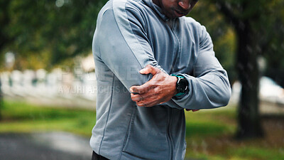 Buy stock photo Fitness, nature and man with elbow injury, pain or accident on run for marathon, race or training. Sports, exercise and athlete with muscle sprain, inflammation or tender joint for cardio workout.