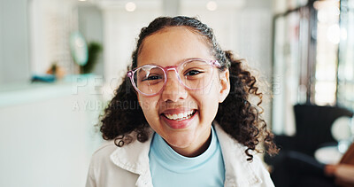 Buy stock photo Happy girl, portrait or glasses with sight at optometry store for eyecare, optical or vision. Female person, child or kid with spectacles for youth development or eye prescription at optometrist shop