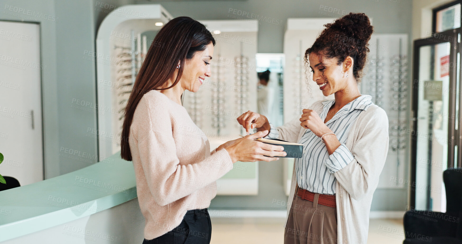 Buy stock photo Happy women, optometrist and customer with new glasses for client service, sight or vision at shop. Female people, store or person buying spectacles with smile or box for eyecare or visual aid