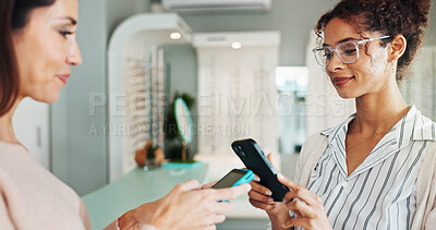 Buy stock photo Happy woman, customer and optometrist with pos machine for payment or wireless transaction at optometry store. Female people, client and phone with mobile purchase app for glasses, sight or vision