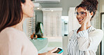 Happy woman, customer and glasses with optometrist or pos machine for payment at optometry store. Female people, client and smile with spectacles or visual aid for choice, purchase or sight at shop