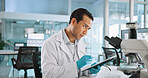 Scientist, man and tablet with thinking for analysis, breakthrough or medical research notes. Biotech, laboratory and microscope with DNA study for pharmaceutical RNA or pathology experiment project