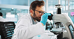 Scientist, man and medical study with microscope at lab with sample, review and glasses for pharma job. Person, gloves and equipment with process for vaccine innovation, trial and clinical research