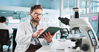Buy stock photo Scientist, man and research with tablet at lab with writing, review and medical notes for pharma job. Person, gloves and equipment with application for vaccine development, trial and clinical study