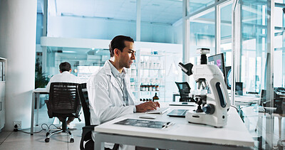 Buy stock photo Innovation, laptop and science with man in laboratory for healthcare, medical or pharmaceutical research. Computer, microscope and typing on keyboard with scientist in clinical trial for development
