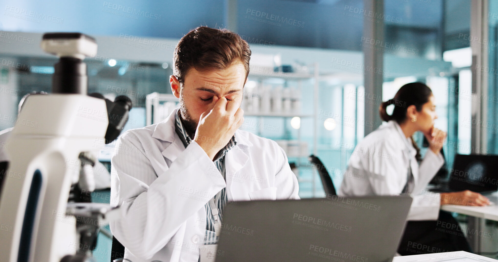 Buy stock photo Research, science and man in lab, headache or laptop with vaccine development, burnout or tired. People, employees or scientist in workplace, migraine or fatigue with mistake, frustrated or exhausted