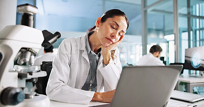 Buy stock photo Woman, scientist and tired with sleep in lab with laptop for medical development, virus or bacteria dna. Person, fatigue and clinical study for vaccine with burnout, exhausted or pharmaceutical trial