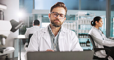 Buy stock photo Reading, laptop and science with man in laboratory for clinical trail, online and research. Medical journal report, review and pharmacy drug development with person for healthcare and biotechnology