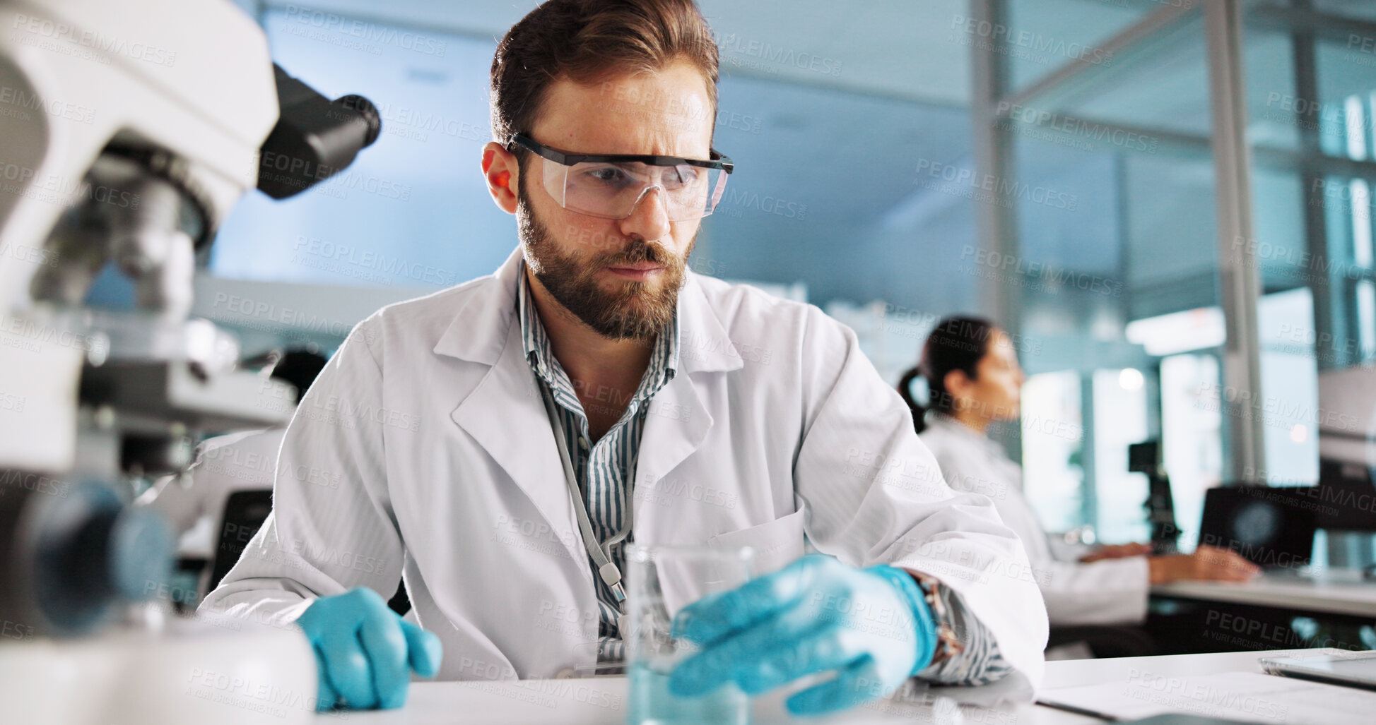 Buy stock photo Scientist, man and chemical with microscope for research, breakthrough or medical analysis. Biotech, laboratory and beaker with DNA for pharmaceutical RNA study or chemistry experiment project