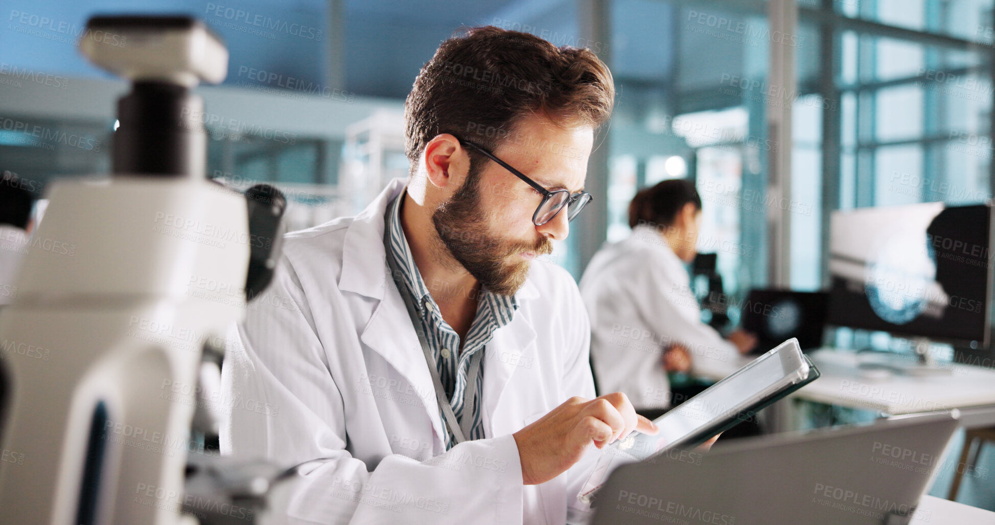 Buy stock photo Scientist, man and tablet with research for biology, breakthrough or medical notes analysis. Biotech, laboratory and microscope with DNA for pharmaceutical RNA study or chemical experiment project