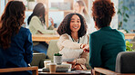 Happy woman, meeting and handshake with documents for interview, CV review or job application at office. Female person, colleagues or shaking hands with smile for agreement, deal or contract together