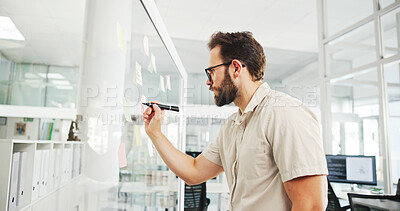 Buy stock photo Business, glass wall and man in office, writing and decision with brainstorming for proposal. Person, employee and sales consultant in workplace, problem solving and planning for project or choice
