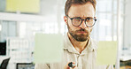 Business man, sticky notes and thinking by glass wall for campaign ideas, project management or ROI solution. Marketing manager, employee or planning for advertising strategy, vision or brainstorming