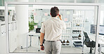 Business, glass wall and man with back, writing and planning with ideas for project. Person, employee and consultant in workplace, problem solving and brainstorming with choice, research and decision