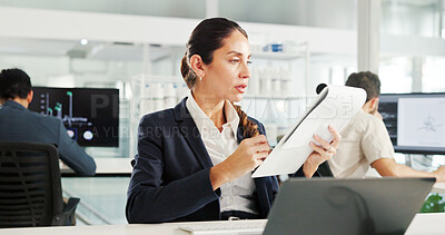 Buy stock photo Woman, documents and laptop at office for finance, results or report for trading on stock market. Person, paperwork and reading with perspective for accounting, revenue or profit at investment agency