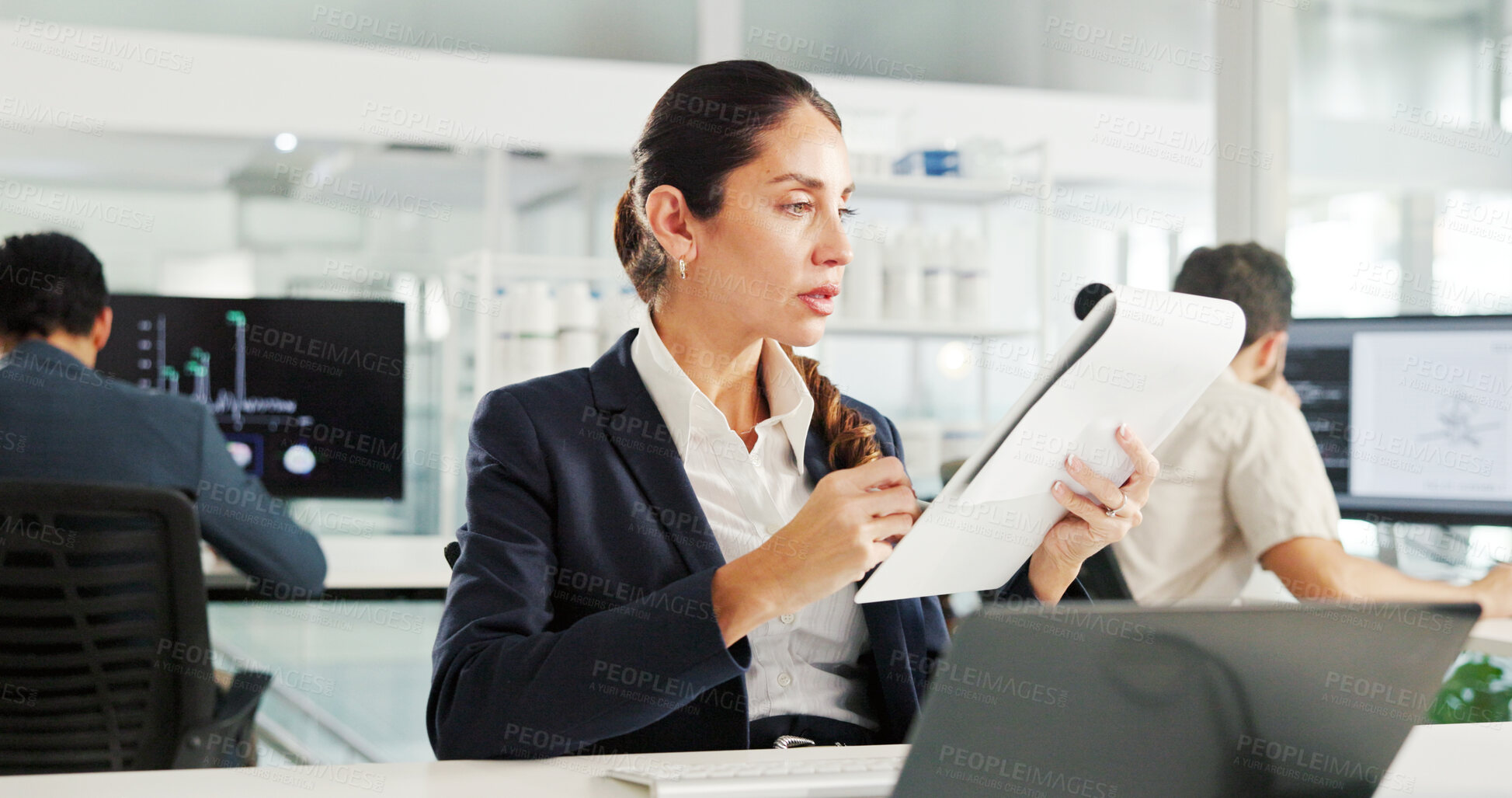 Buy stock photo Woman, documents and laptop at office for finance, results or report for trading on stock market. Person, paperwork and reading with perspective for accounting, revenue or profit at investment agency