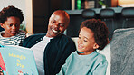 Black family, father and children with book on sofa for storytelling, language development or bonding. Happy people, man or boys in home with fantasy novel for knowledge, literacy support and reading