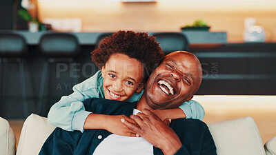 Buy stock photo Portrait, hug and father with son, funny and bonding together with joke in living room. Face, African family or parent on sofa, dad or boy with happiness, embrace or home with humor, laugh or relax