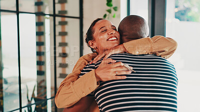 Buy stock photo Hug, smile and couple with key, new house and celebration for mortgage, moving in and love in lounge. Real estate, embrace and people with success of home loan, happiness and excited for investment