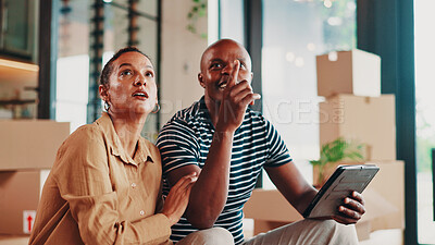 Buy stock photo New home, property and couple with tablet, boxes and conversation for renovation. African man, apartment and woman with discussion, real estate or moving house with digital app for planning or talk