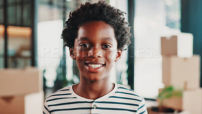 Buy stock photo Happy, moving day and portrait of child in home with boxes with smile for new house, apartment or rental. Family, real estate and African boy ready for relocation for property, investment or purchase
