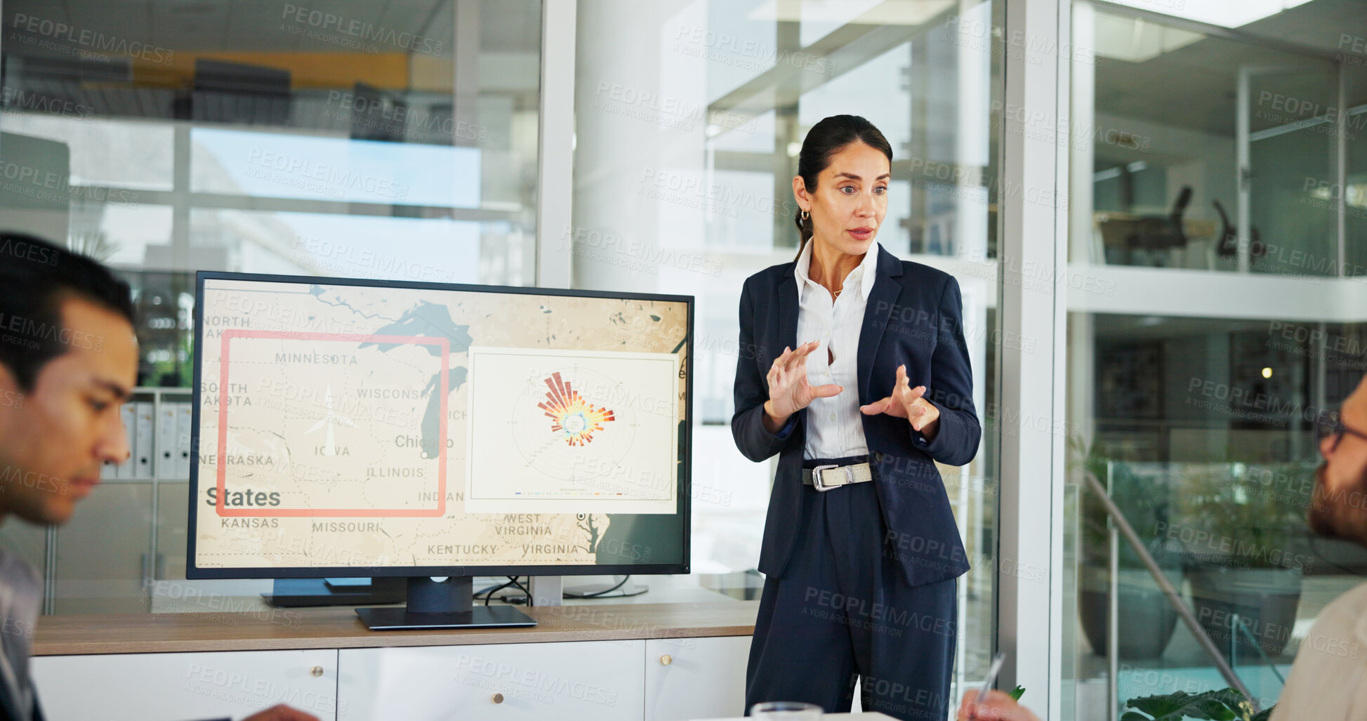 Buy stock photo Business woman, screen and map with presentation for renewable or clean energy at conference. Female person, employee or speaker talking with technology display for wind turbine or global development
