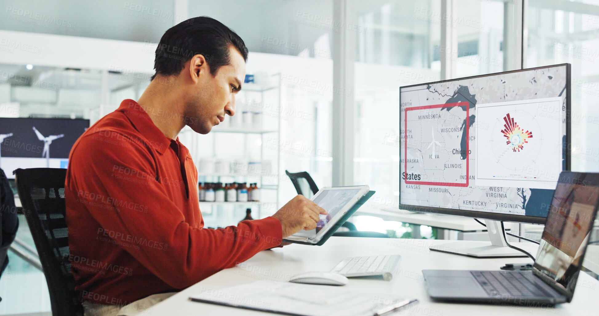Buy stock photo Computer screen, tablet and wind turbine with business man in office for renewable energy or sustainability. Ecology, electricity and windmill with map on display for development or engineering