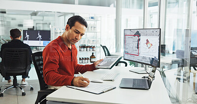 Buy stock photo Notebook, tablet and wind turbine with business man in office for renewable energy or sustainability. Electricity, windmill and writing with map on computer screen for development or engineering