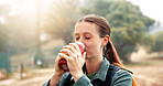 Break, drinking water and woman with hiker outdoor in nature for adventure, hobby or journey. Bottle, hydration and vacation with thirsty person hiking in park for morning exploration or health