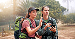 Hiking, phone and women on mountain for direction, navigation and digital map for path. Travel, friends and people lost on smartphone to search location, trail and trekking on adventure in nature