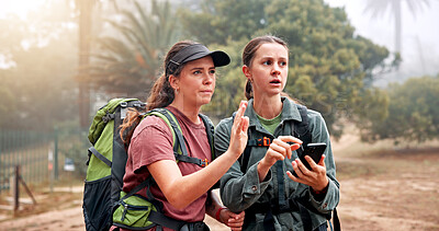 Buy stock photo Hiking, phone and women on mountain for direction, navigation and digital map for path. Travel, friends and people lost on smartphone to search location, trail and trekking on adventure in nature