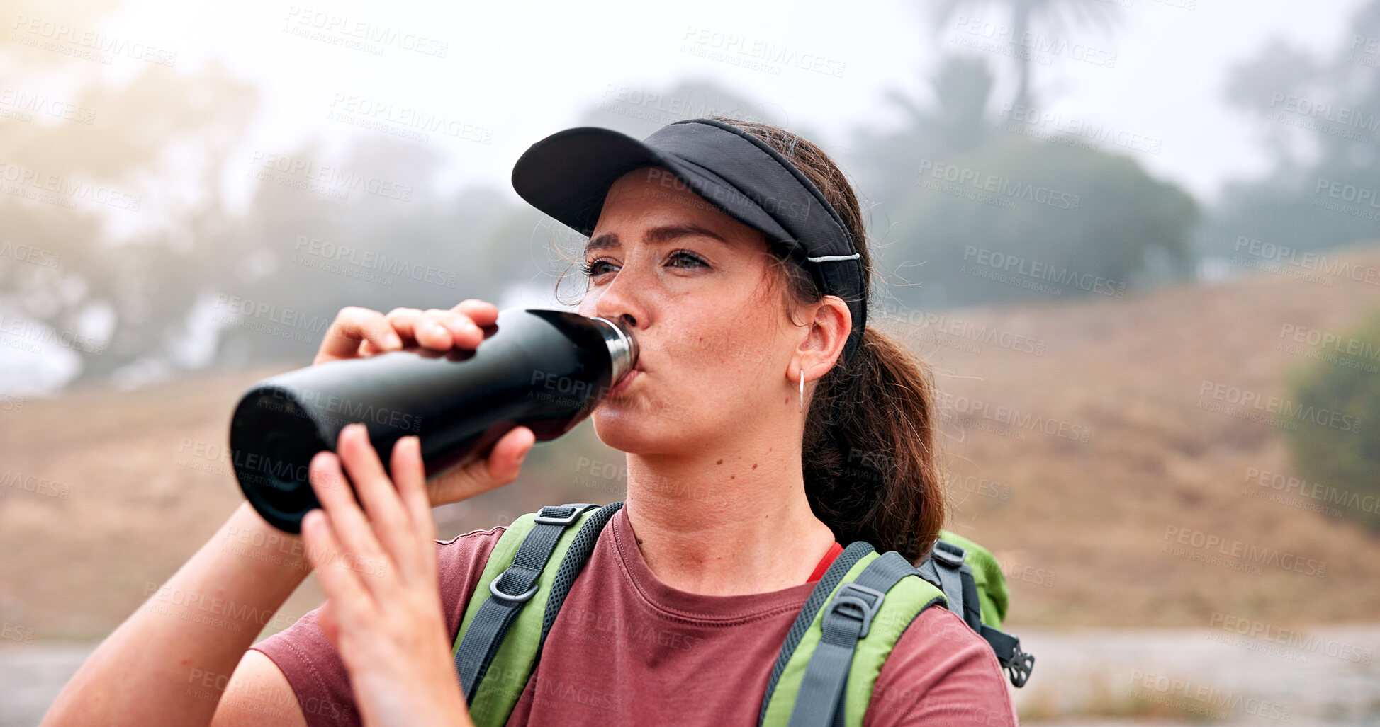 Buy stock photo Break, drinking water and hiking with woman outdoor in nature for adventure, hobby or journey. Bottle, hydration and vacation with thirsty hiker person in park for morning exploration or health