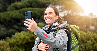 Buy stock photo Hiking, video call and phone with woman in nature for streaming, travel and adventure. Virtual chat, trekking and environment with person and mobile for eco tourism, backpacking and vacation