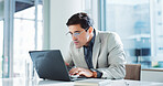 Corporate, typing and business man on laptop for insurance, risk management or policy sales. Technology, serious employee and reading email for financial coverage, review claims or research in office