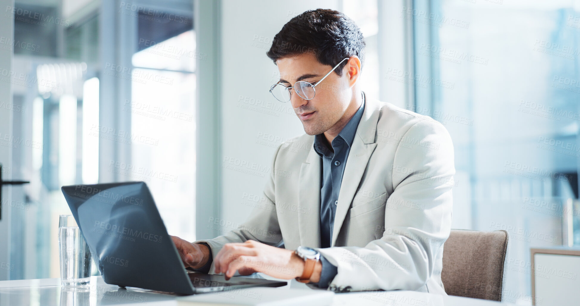 Buy stock photo Internet, typing and business man on laptop for insurance, risk management or policy sales. Technology, serious employee and reading email for financial coverage, review claims or research in office