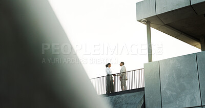Buy stock photo Handshake, rooftop and teamwork with business people outdoor for discussion or planning. Building, city or real estate with client and developer shaking hands for commercial investment from below