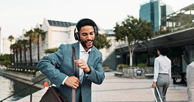 Buy stock photo Business, man and dancing with headphones in city for work commute, radio streaming and morning energy. Professional, person and happy outdoor for job opportunity, celebration and travel with music
