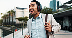 Businessman, happy and dancing outdoor with headphones for morning commute, audio playlist or streaming music. Professional, person and walking in city with sound track, radio and travel to new job