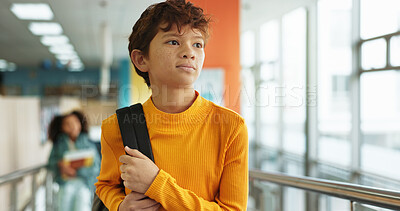 Buy stock photo Student, child and thinking with walk, corridor and backpack for class, lesson or recess at campus or academy. Pupil, boy and growth for education, development and scholarship in learning or school