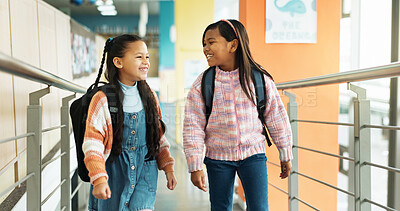 Buy stock photo School, hallway and happy girls with backpack walking for studying, classroom and learning on campus. Students, friends and children in corridor talking for education, academy or knowledge in morning