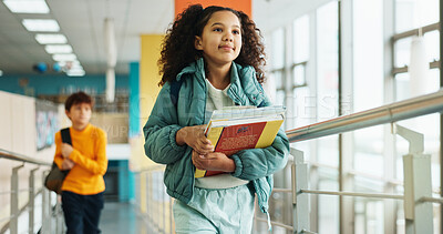 Buy stock photo Student, girl and walk with books, hallway and backpack for class, lesson or recess at campus or academy. Pupil, child and growth for education, development and scholarship in learning or school
