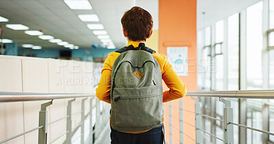Buy stock photo School, hallway and back of child with backpack walking for studying, classroom and learning. Students, campus lobby and boy in corridor with bag for education, academy and knowledge in morning