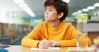 Buy stock photo Boy, child and paper with thinking at library for learning, study and development with problem solving. Kid, notes and solution with education, assessment or school project with scholarship in hall