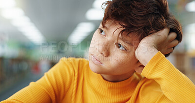 Buy stock photo Thinking, child and student in library at school for planning, ideas and study of learning solution. Bored, boy and lazy kid with thoughts for education challenge, problem solving and exam reflection